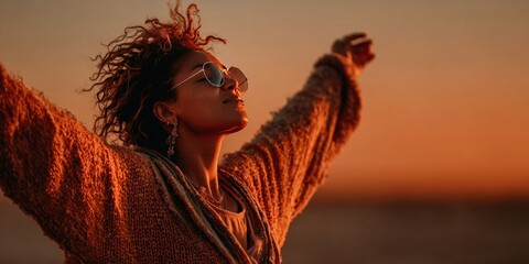 Woman raising arms in celebration, symbol of freedom and empowerment