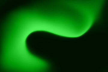 Abstract green light pattern on a dark background with smooth transitions