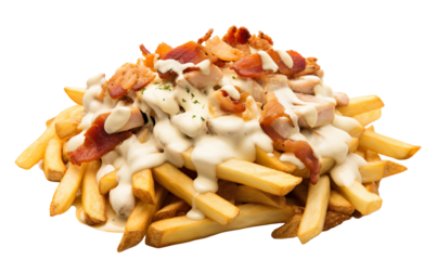 fast food, small pieces of cut up roast chicken sitting on a bed of hot thick fries, small pieces of bacon, all covered in thin creamy drizzle of white sauce in a zig zag pattern over everything