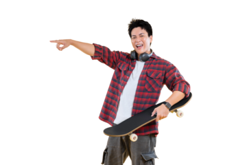 A young man holding a skateboard, pointing his finger joyfully. He is wearing a red and black checked shirt and gray cargo pants with headphone on png background