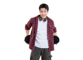 A smiling young man holds a skateboard, He looks happy and ready to skate. Wearing a casual outfit with headphones around his neck on png background