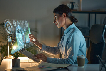 Businesswoman Interacting with Holographic Interface Displaying Advanced Cybersecurity Analytics,...
