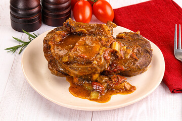 Italian cuisine - ossobuco with sauce