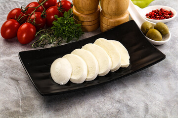 Organic mozzarella cheese slices in the plate