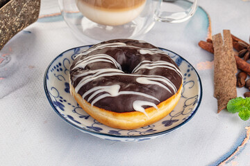 Delicous sweet donut with chocolate glaze