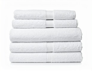 stacked pile of soft, fluffy white towels isolated on white 
