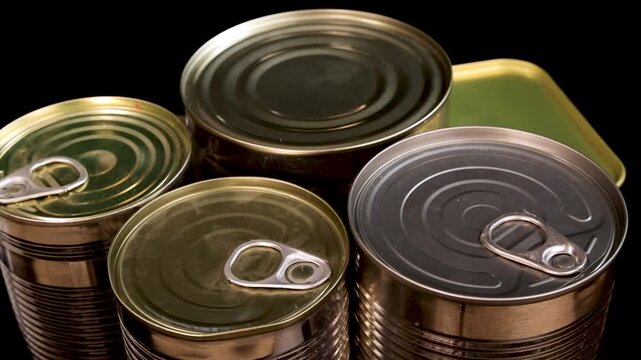 Rotating Assortment of Canned Food on Black Background