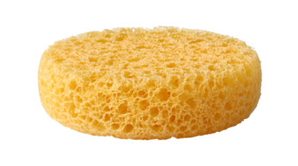 A small, round cradle cap sponge, specifically textured for mild exfoliation and safe removal of flakes from a baby's head, isolated on a pure Transparent background.