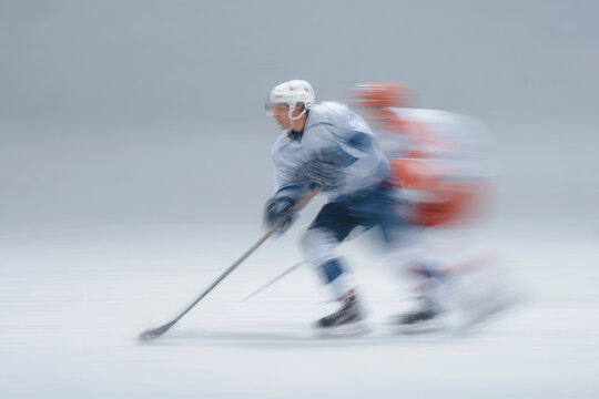 exciting scene of players in traditional valenki boots engaged in dynamic ice hockey shot