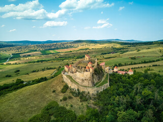 Aerial drone view on Rupea Fortress is a medieval fortress built by Transylvanian Saxons in the...