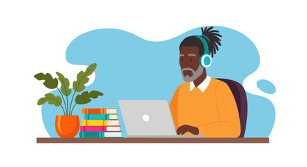 Senior man with headphones using laptop, perfect for online learning or remote work websites.