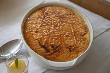 Traditional Portuguese leite creme (milk custard) with caramelized sugar crust, served fresh in a...