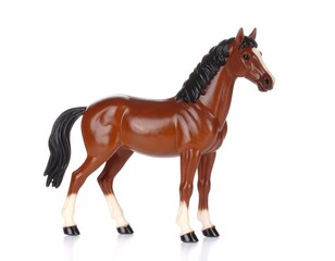 Obraz premium Brown plastic toy horse, standing, isolated on white