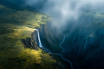 Aerial View of Stunning Waterfall Flowing into Canyon