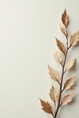 Dried Branch with Delicate Autumn Leaves on a Neutral Background A Simple, Elegant Nature Image