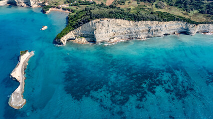 aerial landscape view of area around amazing sandstone cliffs Esperii Rock and Mermaid‘s Rock located at Sidari coastline in north part of Corfu Island, Greece with Apotripiti Beach in background