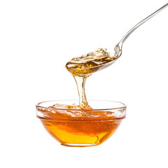 Golden honey dripping from spoon into bowl, isolated against a black backdrop