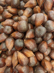 a bunch of unpeeled salak fruit
