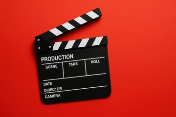 Film Production Clapperboard Against Vibrant Red Background Cinematic Tool Visual Storytelling Creative Industry Concept