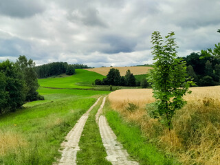 Incoming storm over country road in Kashubia.