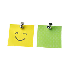 Two colorful sticky notes on black background with happy face and green paper held by magnets.