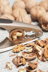 Close up of nutcracker and walnuts