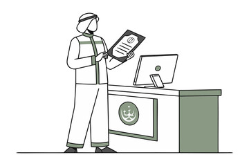 A professional man in traditional middle eastern attire reviews a document at a modern office reception desk with a computer