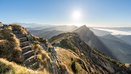 Stairway to heaven. On the summit of Mittaggüpfi mountain, with views over the Napf mountains and the Bernese Oberland. Switzerland.