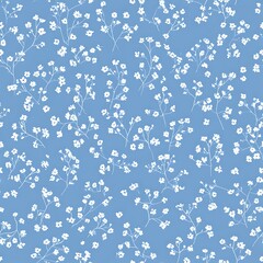 Tiny white flowers on a light blue background, a seamless pattern