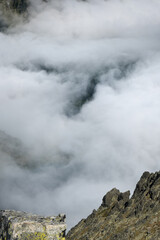 Mountain climbing looking down at the surrounding space.
