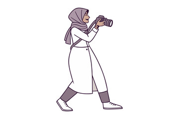 A woman wearing a hijab and a long white coat walks while holding a camera to take a photograph