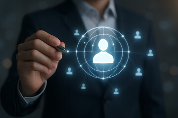 Businessman holding glowing hologram of digital user icon showing customer network, online targeting, client connection and engagement in a futuristic marketing interface design