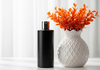Black Cosmetic Bottle and White Pineapple Vase with Orange Plants
