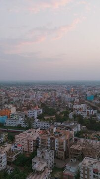 Urban transportation at bridge road at Delhi. Cinematic cityscape of downtown freeway drone shot. Noida Freeway. Top down Buildings and Apartment with Multiple Building aerial. Noida Buildings.