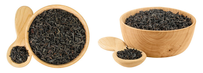 Dry black tea leaves in wooden bowl and spoon isolated on white background. Top view. Flat lay