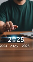 Futuristic technology interface with highlighted year 2025 and power symbol. Business professional planning future strategies. Modern workspace with digital progression themes.