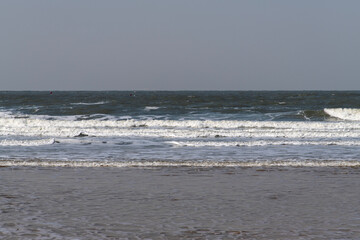 breaking waves on the beach in winter