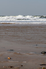breaking waves on the beach in winter