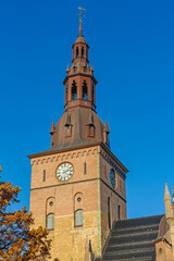 Bell Tower With Clock Dial at Cathedral Church of Norway Diocese of Oslo Sunny Autumn Day