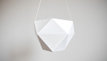 Close-up of a matte white ceramic geometric planter in the shape of a diamond, suspended by minimalist wireframe holder 2