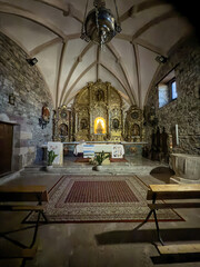 Ornate golden altar inside Santuario del Carmen in Santa Maria de Nava