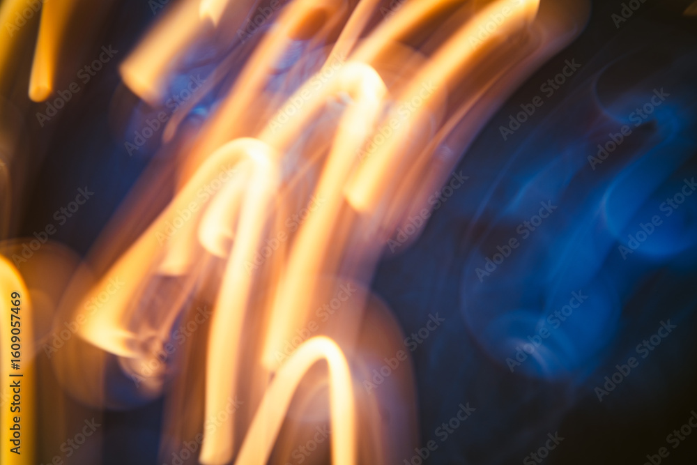 Poster light trails dance through the darkness in a captivating display of color