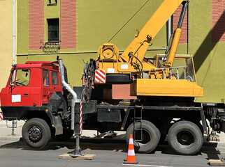 Crane on a truck on the street
