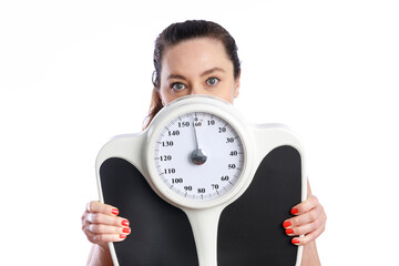 Woman holding scale on white background. Weight management and healthy lifestyle concepts