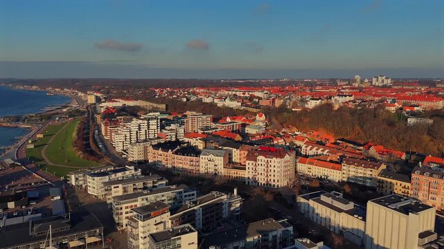 Aerial view of Helsingborg residential area with red rooftops and surrounding parkland on a sunny day in southern Sweden 