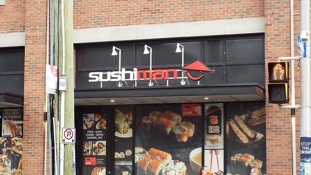 Ottawa, ON, Canada-July 21,2025: The storefront of a "Sushiman" restaurant at  275 Laurier Ave E #261.
