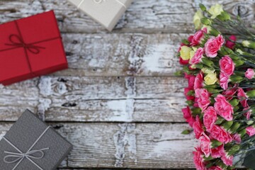 Carnations on a wooden background, free space, top view, gift, presents, flowers, day, holiday