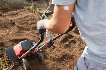 Using a tiller in rich, loamy soil benefits successful plant growth and cultivation