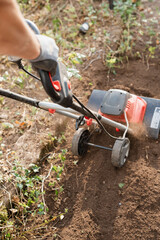 Garden Tiller Working Actively for Efficient Landscaping Tasks and Preparing Soil Properly