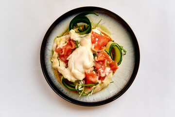 Deliciously Crafted Gourmet Dish with Fresh Salmon, Creamy Sauce, and Colorful Vegetables on a Stylish Plate